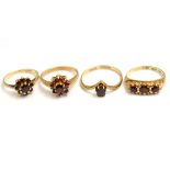 Four garnet set rings, three H/M 9ct, approx gross weight 6.5gms