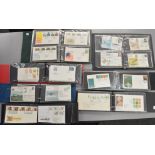 7 Folders containing a large number of First Day Covers