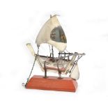 A white metal boat (tested silver) with stand