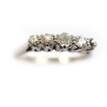 A diamond set ring stamped 18ct plat, the four old cut diamonds total approx 0.24cts (one diamond