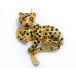 A 9ct H/M leopard brooch, with a diamond set collar, ruby eyes & sapphires, approx 37mm x 30mm,