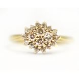 An 18ct H/M diamond cluster ring, diamonds total approx 0.50cts, size P, approx 3.7gms