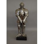 An impressive unboxed Knight figure polished metal sculpture, standing approximately 67cm tall and