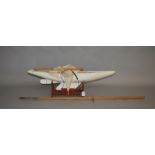 A wooden scratch built Pond Yacht, approximate overall length 87cm complete with wooden stand.