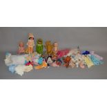 A mixed lot of dolls and accessories, which includes; Barbie doll and outfit, bag of assorted