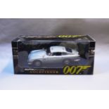 James Bond 007. A boxed Autoart 1:18 scale Aston Martin DB5 version with Gadjets and Roof Panel,