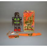 A boxed Horikawa S H (Japan)  battery operated tinplate 'Attacking Martian' Robot toy. Externally