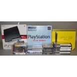A boxed Sony PlayStation 'Dual Shock' Set containing Console, Controller etc. together with two