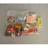 A varied selection of unboxed Dolls House Furniture of wooden, plastic and tinplate construction,