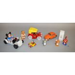 A small collection of battery operated plastic and tin toys which includes Modern Toys Tom and