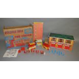 A scarce boxed Mettoy #6259 tinplate County Fire Station.  The tinplate two storey building measures