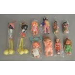 An interesting selection of vintage 'Made in Hong Kong' plastic and padded dolls, most appear to