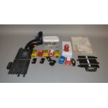 A quantity of Scalextric spare parts including bumpers, grilles, motors etc. and also includes