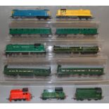 OO Gauge. 9 unboxed Tri-ang Locomotives, including green and yellow variants of the  R155 Diesel