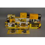 12 Caterpillar die-cast boxed models by Norscot, NZG etc (12).