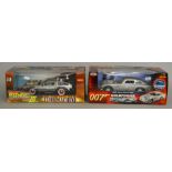 Back To The Future III die-cast time machine by Sun Star together with a James Bond 1965 Aston