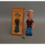 A scarce boxed vintage celluloid 'Popeye' figure, approximately 21cm tall, made in Japan, with