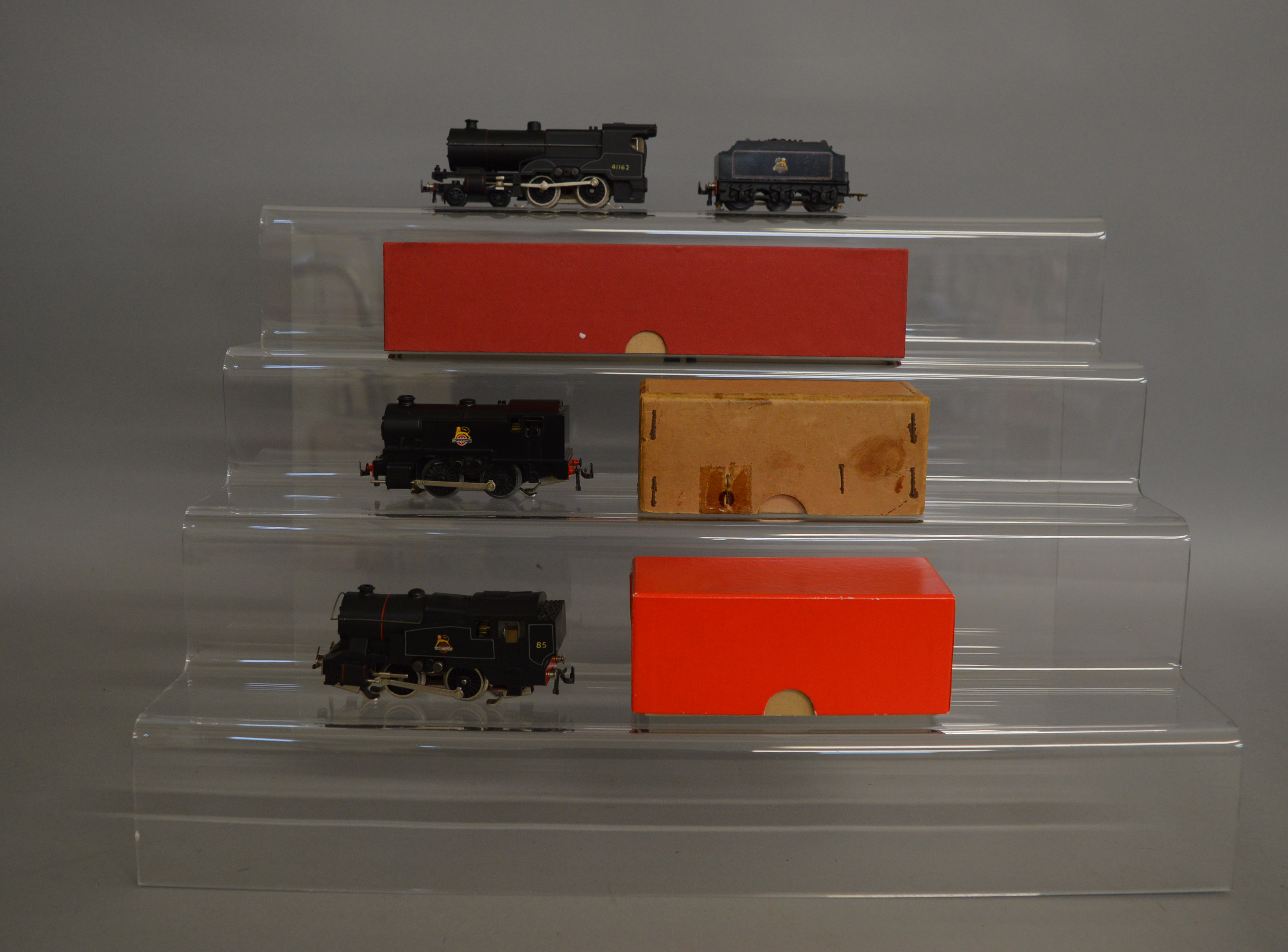 OO Gauge. 3 Trix 3 Rail Locomotives in BR black livery, one in an original box the others in plain