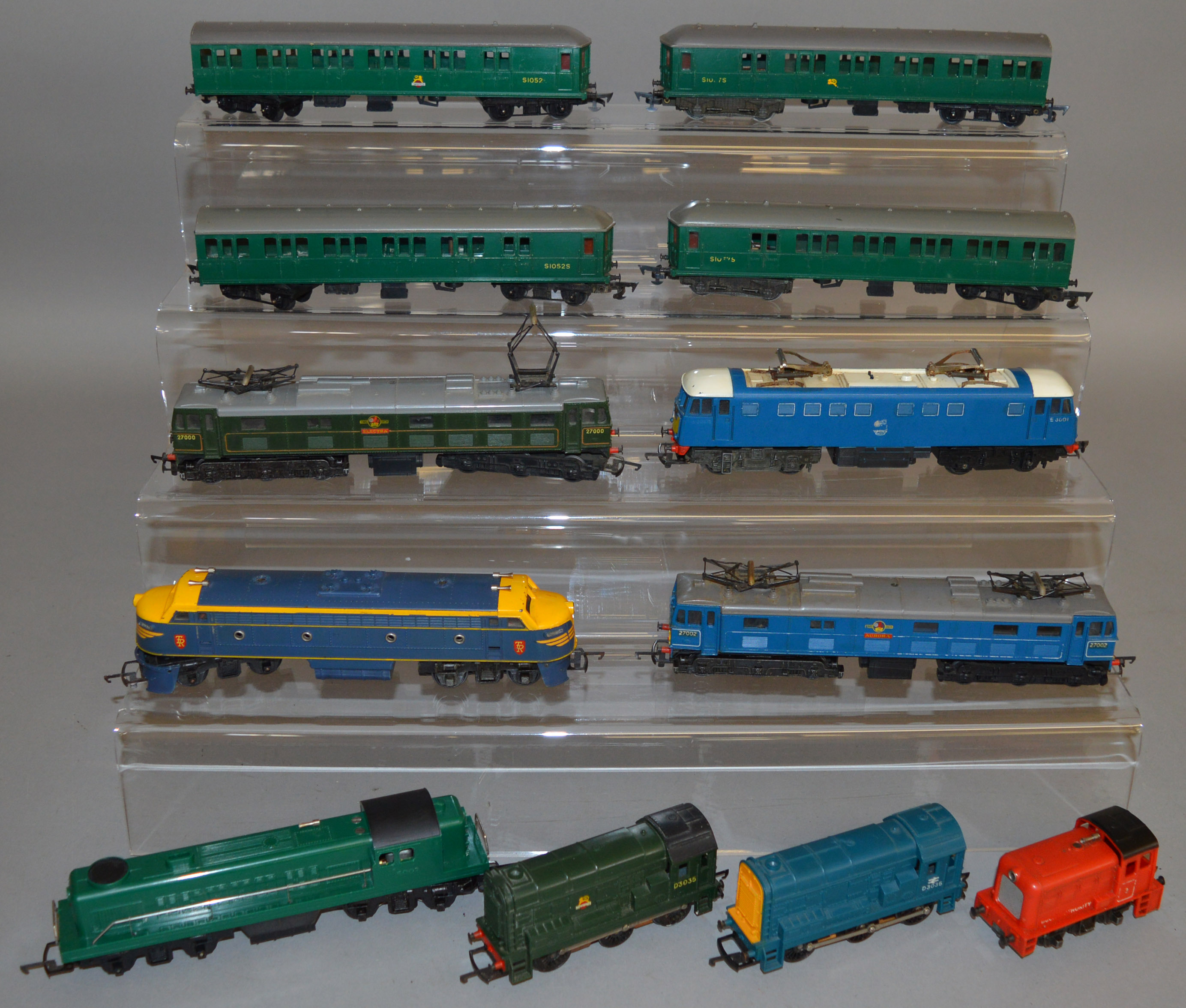 OO Gauge. 9 unboxed Tri-ang Locomotives, including green and yellow variants of the R155 Diesel