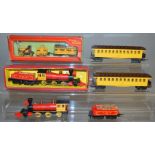 OO Gauge. A boxed Tri-ang R.346 Stepheson's Rocket Train including locomotive, tender and a coach,