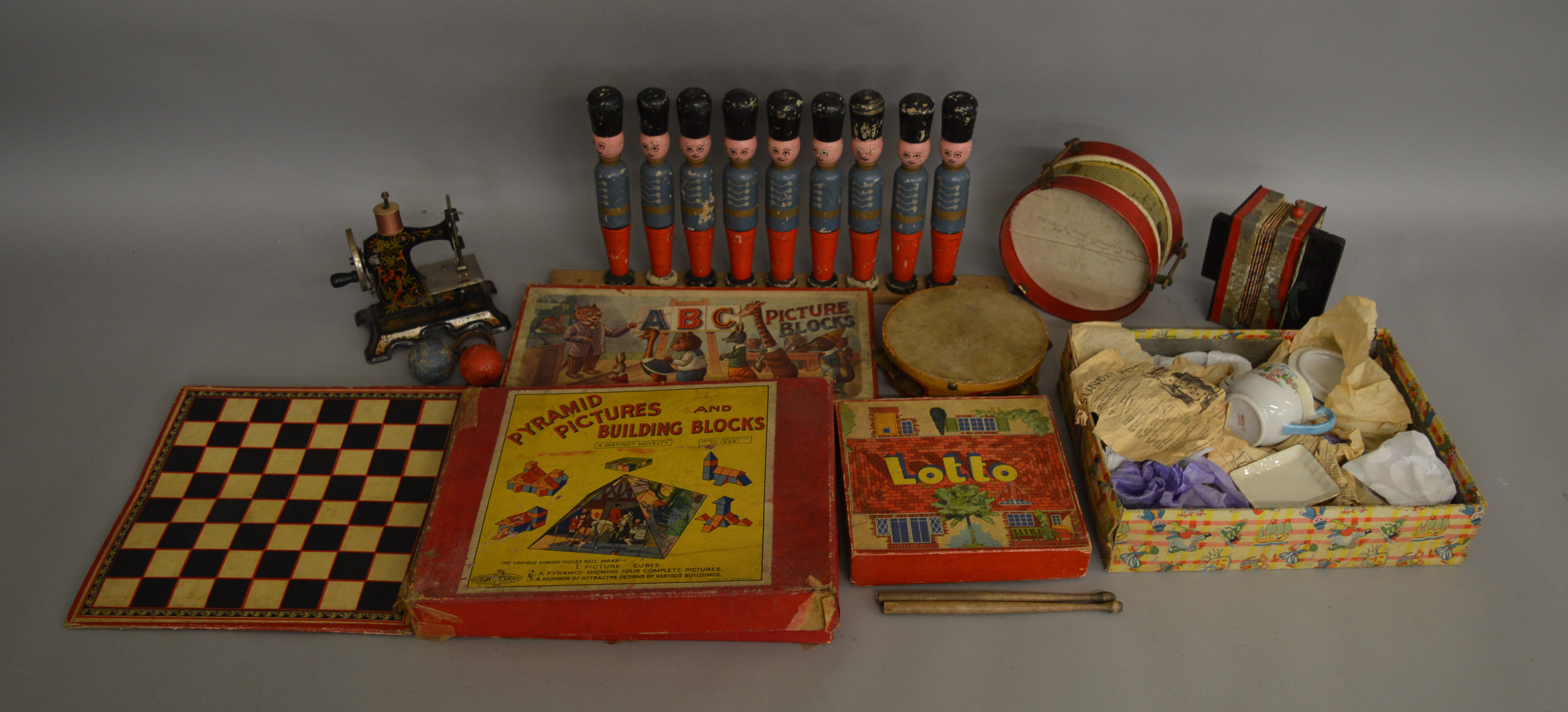 An interesting selection of vintage toys including a Japanese ceramic 'Toy Tea Set', a boxed '