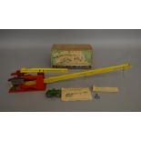 A boxed vintage mechanical  toy 'Up She Goes' by Golden Gate (UK) comprising tinplate track with