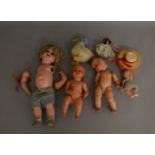 An interesting selection of vintage ceramic, celluloid and plastic dolls of various sizes, some with