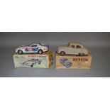 A boxed Taiyo tinplate Rusher Stingray Corvette along with a boxed Electric Austin Somerset by