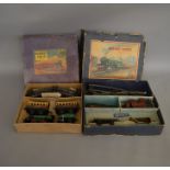 O Gauge. 2 boxed Hornby Train Sets including M1 Passenger Set containing a green 0-4-0 Locomotive