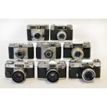 Eight Zeiss Ikon 35mm Cameras.