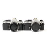 Pair of Chrome Nikon FM2 Camera Bodies.