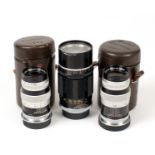 Three Canon 135mm Screw Mount Telephoto Lenses.