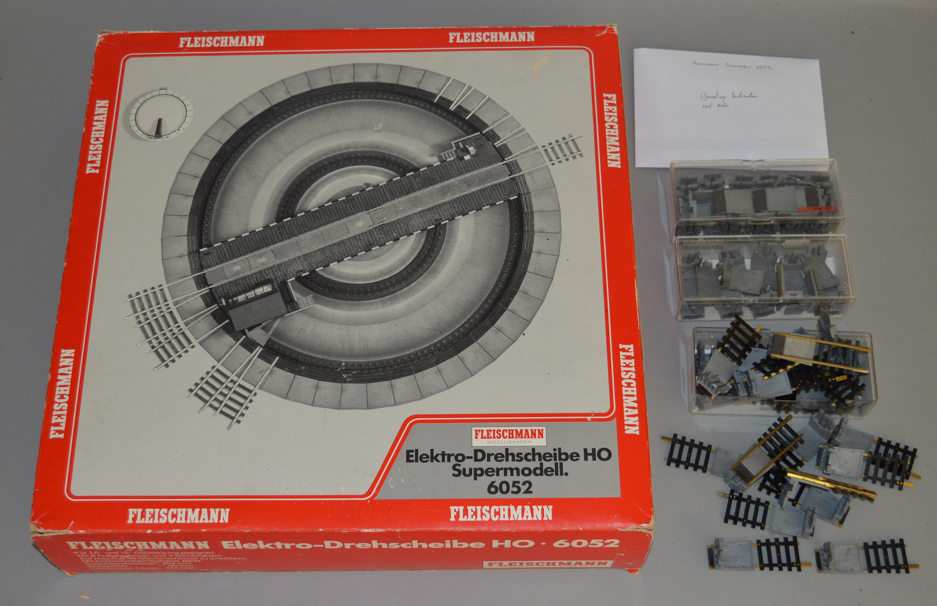 HO Gauge. A boxed Fleischmann #6052 Electric Turntable with up to 48 entry/outlet options together w