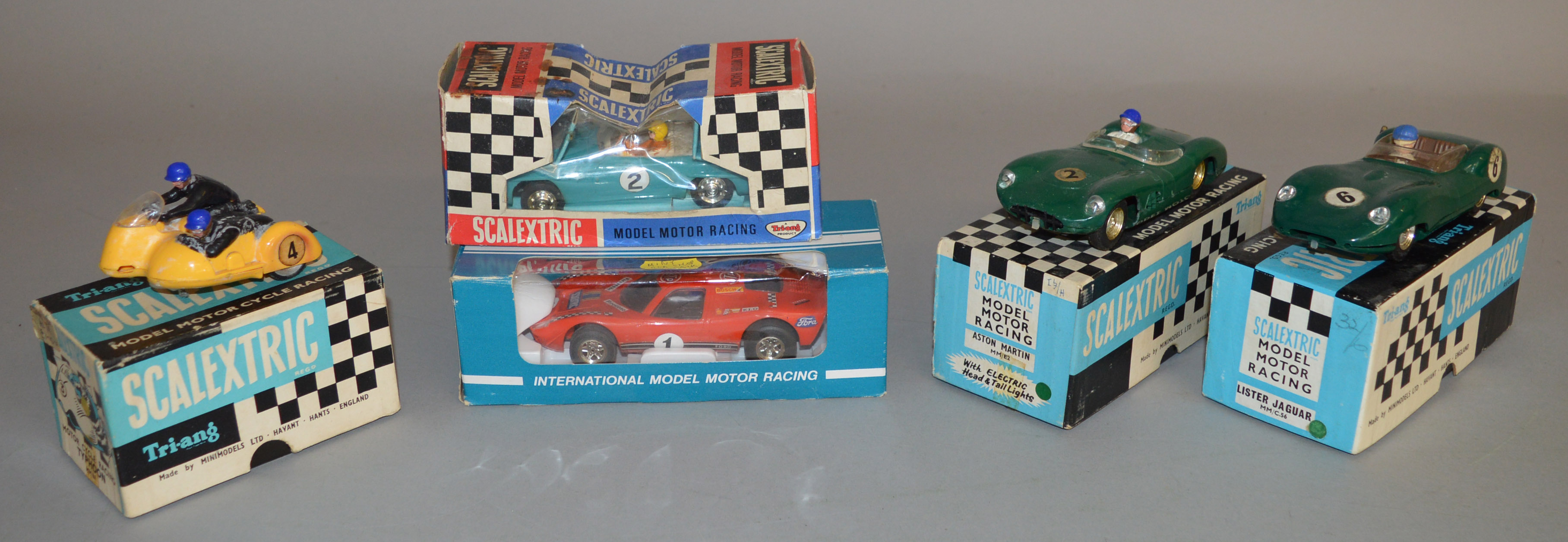 5x Boxed Scalextric models including Lister Jaguar, and Aston martin.