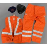 A Great Western Railways Co. cap, an Engine Driver cap and Network Rail fluorescent waistcoat and