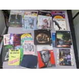 Collection of approx 50+ LPs and concert books. Records include Wings, Fleetwood Mac, Rolling