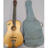 Vintage Martin Coletti acoustic guitar with case. Shows signs of wear in need of restringing. (1)