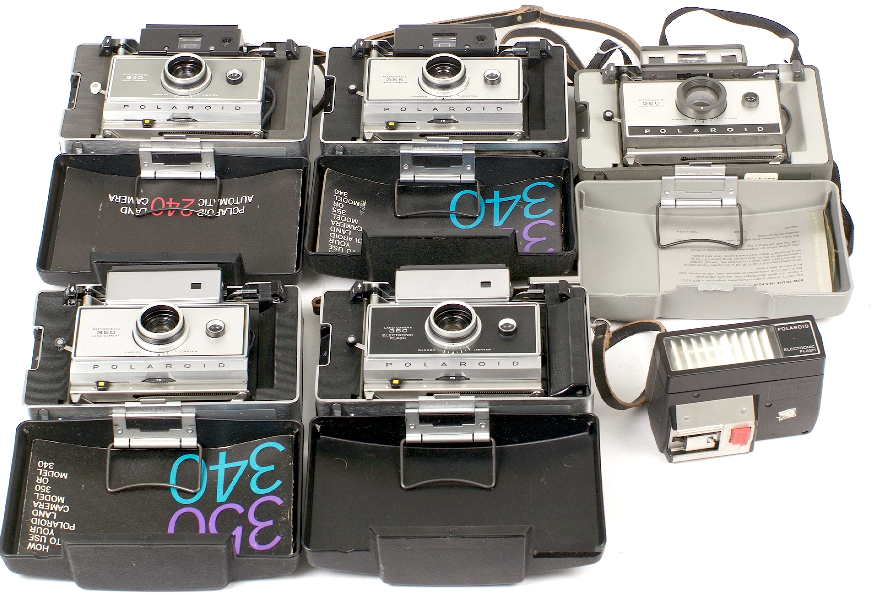 Group of Five Folding Polaroid Land Instant Print Cameras.