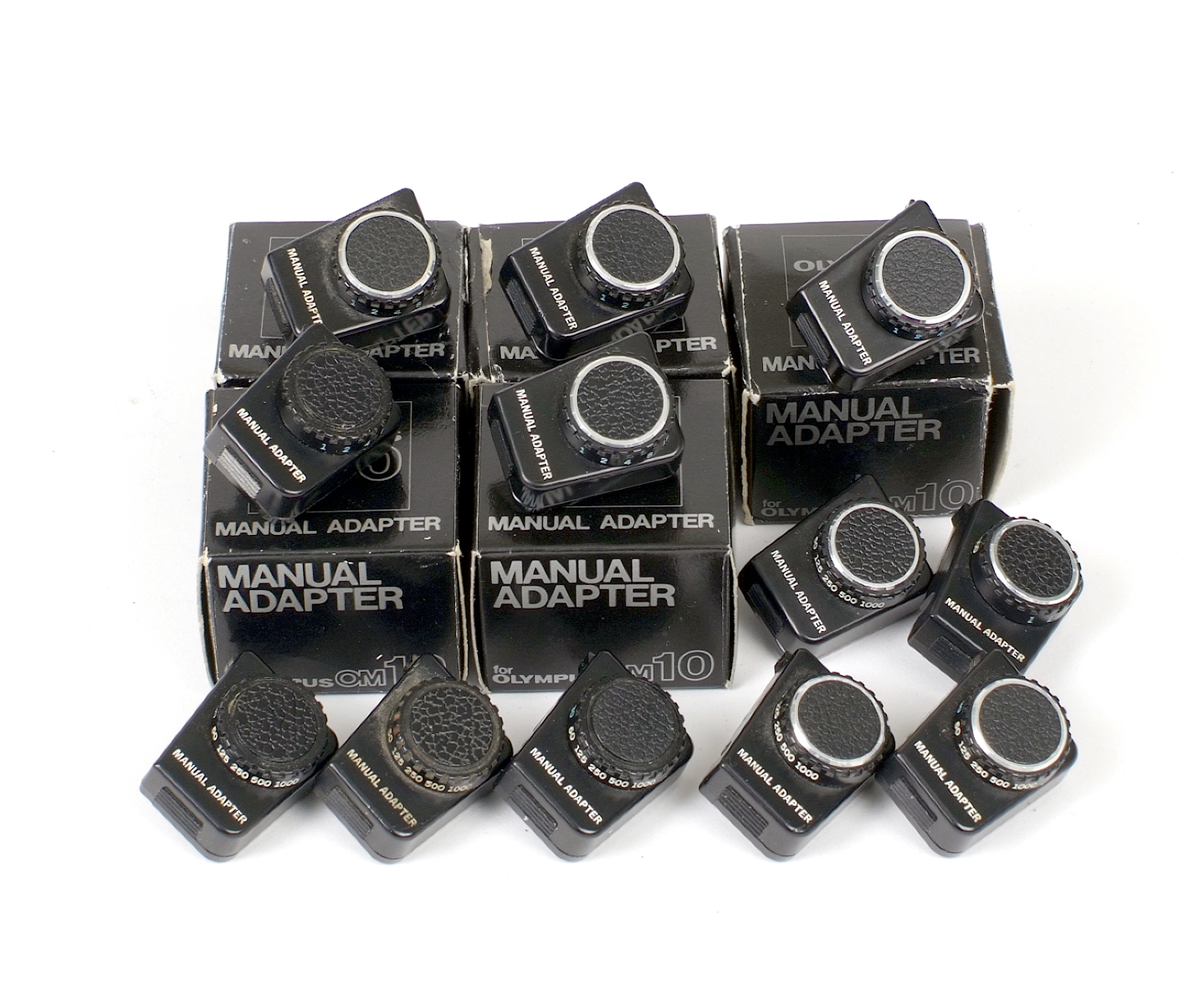 Group of 12 Olympus OM10 Manual Adapters.