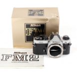Chrome Nikon FM2n #8410746 (condition 5F) in maker's box.