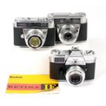 Three Kodak Retina Cameras.