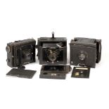 Three Large Folding Strut Plate Cameras.