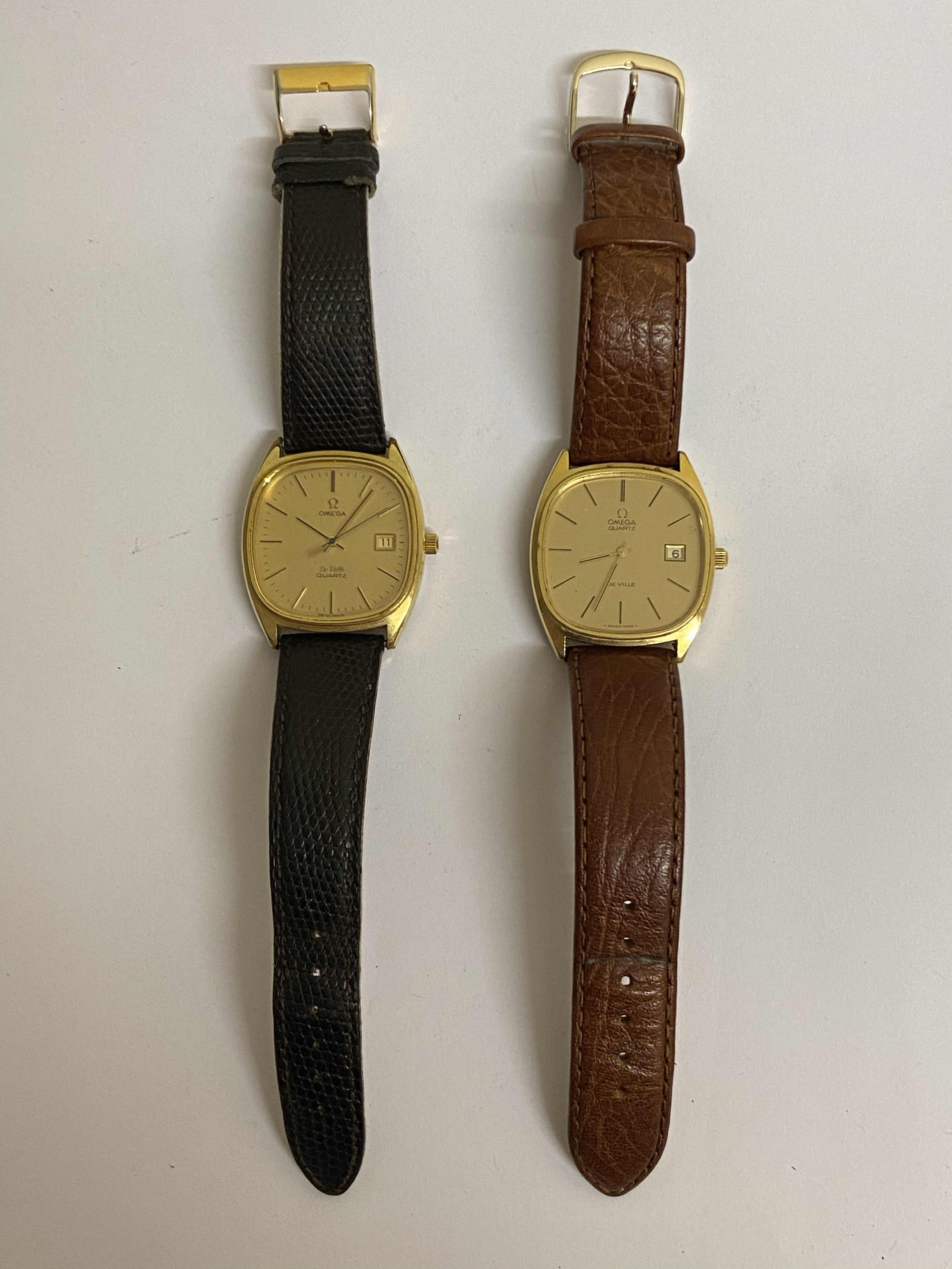 OMEGA - Two Omega De-Ville  quartz gents wristwatches on later leather straps, both require