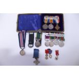 A small collection of miniature medals to include a First War 1915 Trio in case with G.H.F