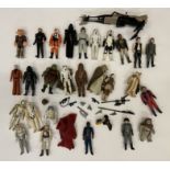 28x Vintage loose star Wars figures together with a quantity of weapons.