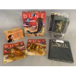 A collection of Dune toys and memorabilia including vintage carded and boxed vehicles and figures (