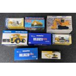 8x Komatsu construction vehicle models by various manufacturers including Joal and NZG, all boxed.