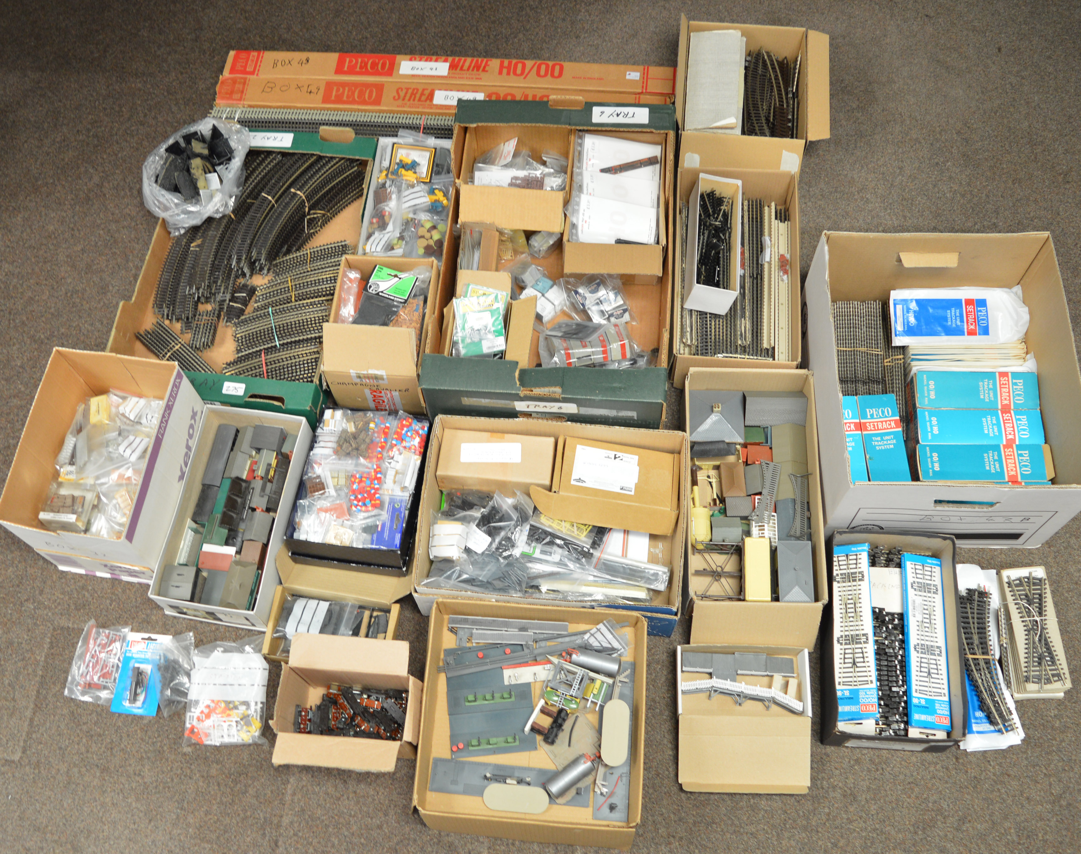 A large quantity of assorted model railway accessories including loose railway layout buildings