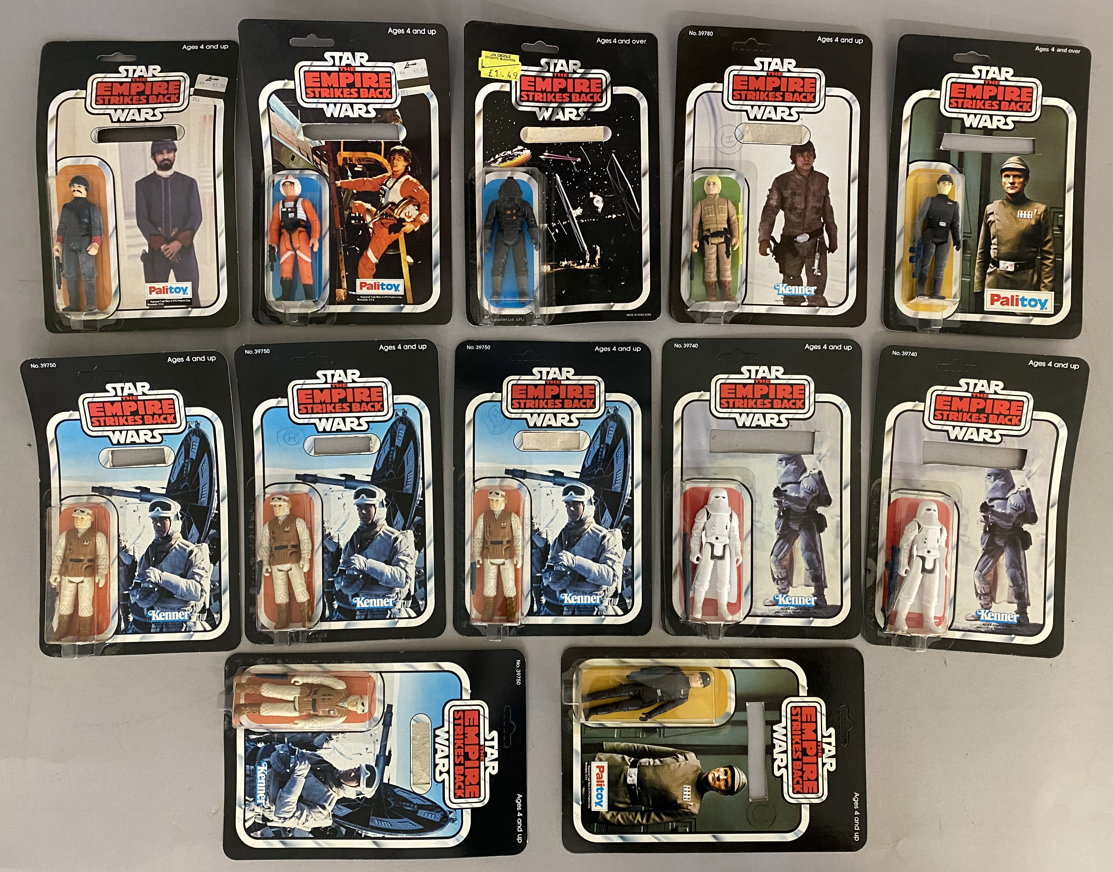 12 vintage Star Wars figures - all sealed on cards but cards have all had the name section removed f