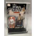 Kenner Star Wars Luke Skywalker on 12-back card. With hard plastic protective case. Note damage to c